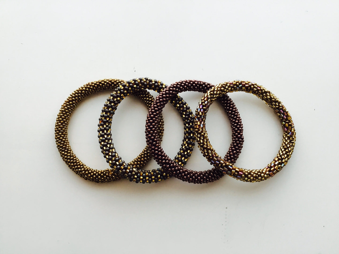 Nepal Beaded Slide On Bracelets Set of 4 Gold Brown Bronze