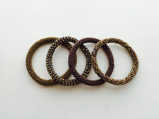 Nepal Beaded Slide On Bracelets Set of 4 Gold Brown Bronze